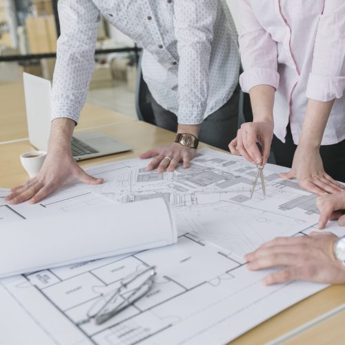 business-people-looking-plans-office